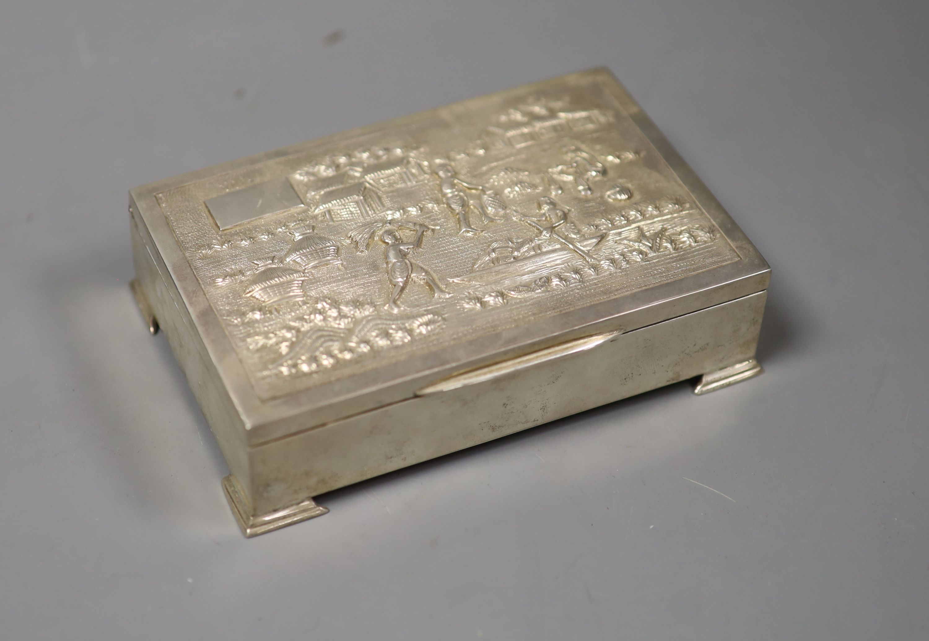 An Indian white metal mounted (stamped sterling silver) rectangular cigarette box